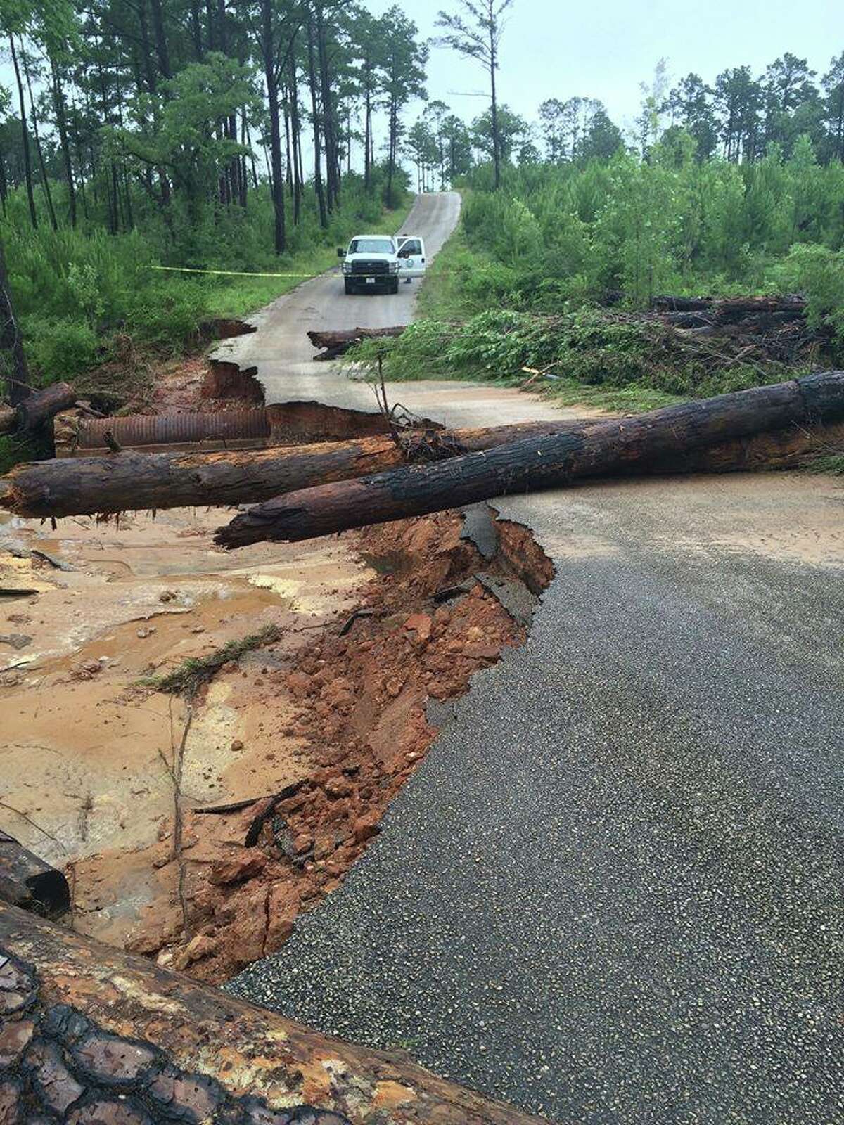 Flood damage on the park road between Bastrop and Buescher State Parks. The parks are open, though some areas are closed due to flood damage. Park Road 1C is closed.