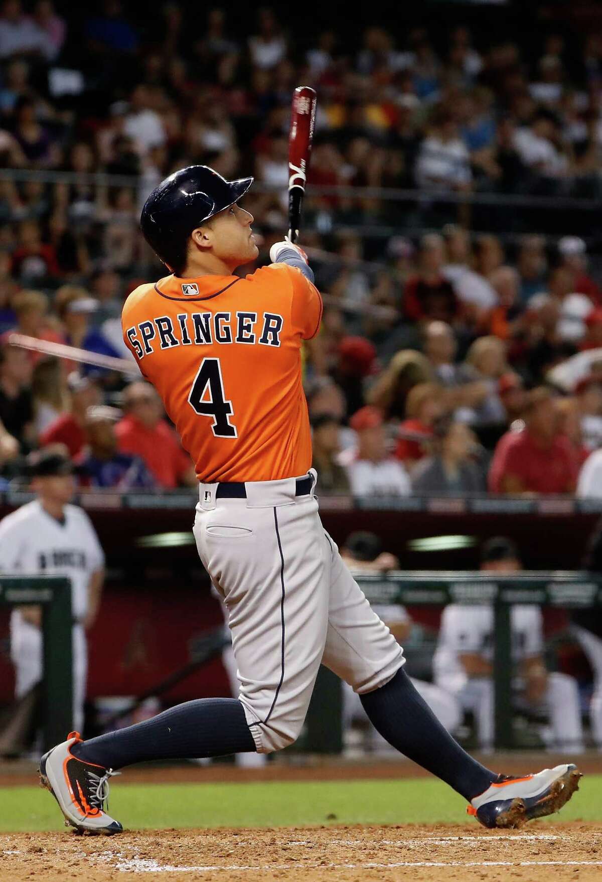 George Springer keeps his eyes on the ball as it heads over the right-field fence for a second-inning homer Tuesday. Batting leadoff over the last eight games, he has hit .457, and the Astros have gone 7-1.