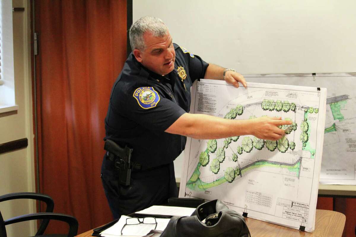 Police Chief Foti Koskinas explains to Kristan Hamlin, RTM District 4, the scope of the $1.5 million renovation to take place at Lot 1 of the Westport train station.