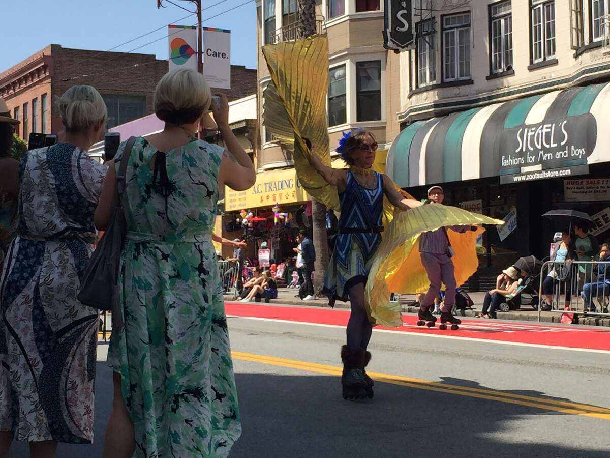 Bystanders take video of San Francisco's Carnaval Parade on May 28, 2016.