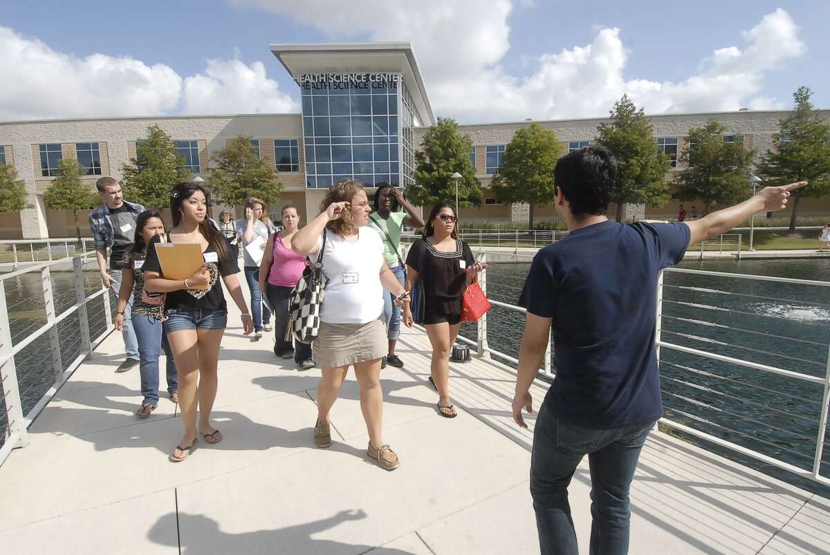 A student leader helps conduct tours for new students at Lone Star College-CyFair. The college is organizing summer information sessions.