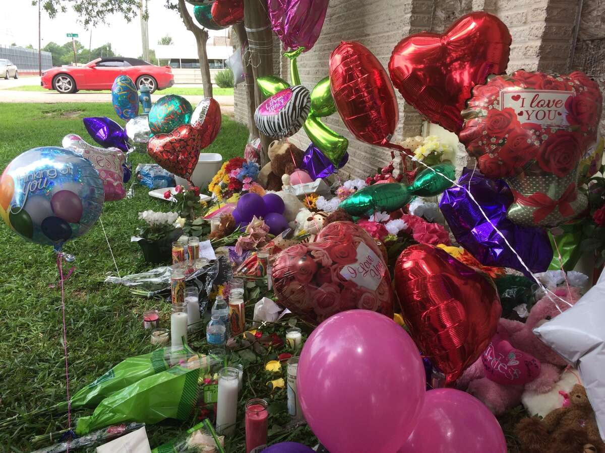 Balloons and candles adorn a makeshift memorial for Karen Perez, a 15-year-old student at South Houston High School on Wednesday, June 1, 2016. Investigators say Perez was sexually assaulted and murdered by her boyfriend.