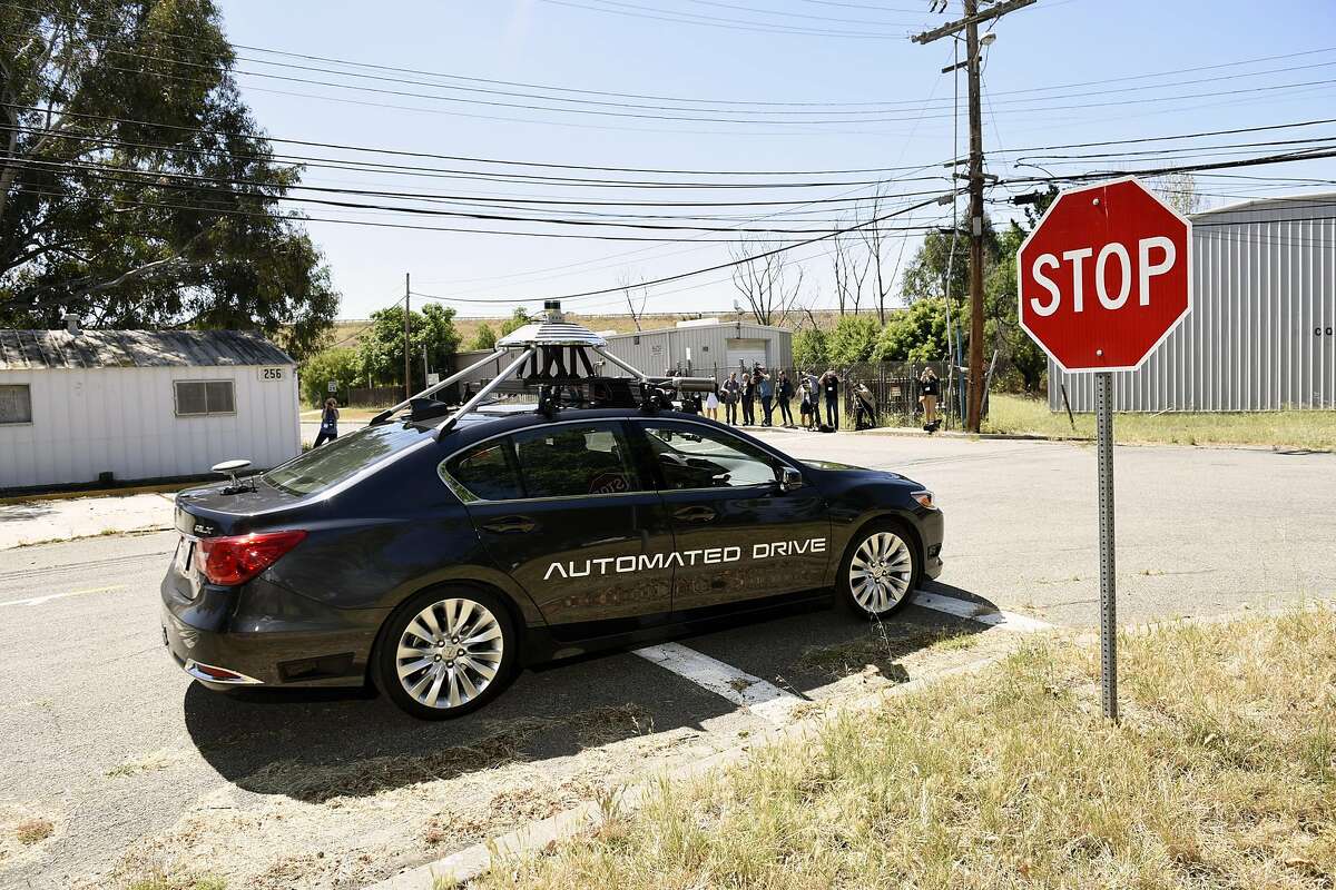A self-driving Accura RLX turns a corner after stopping at a stop sign during a demonstration at GoMentum Station, Honda's 5,000-acre self-driving car proving grounds at the old Concord Naval Weapons Station, in Concord, CA Wednesday, June 1st, 2016.