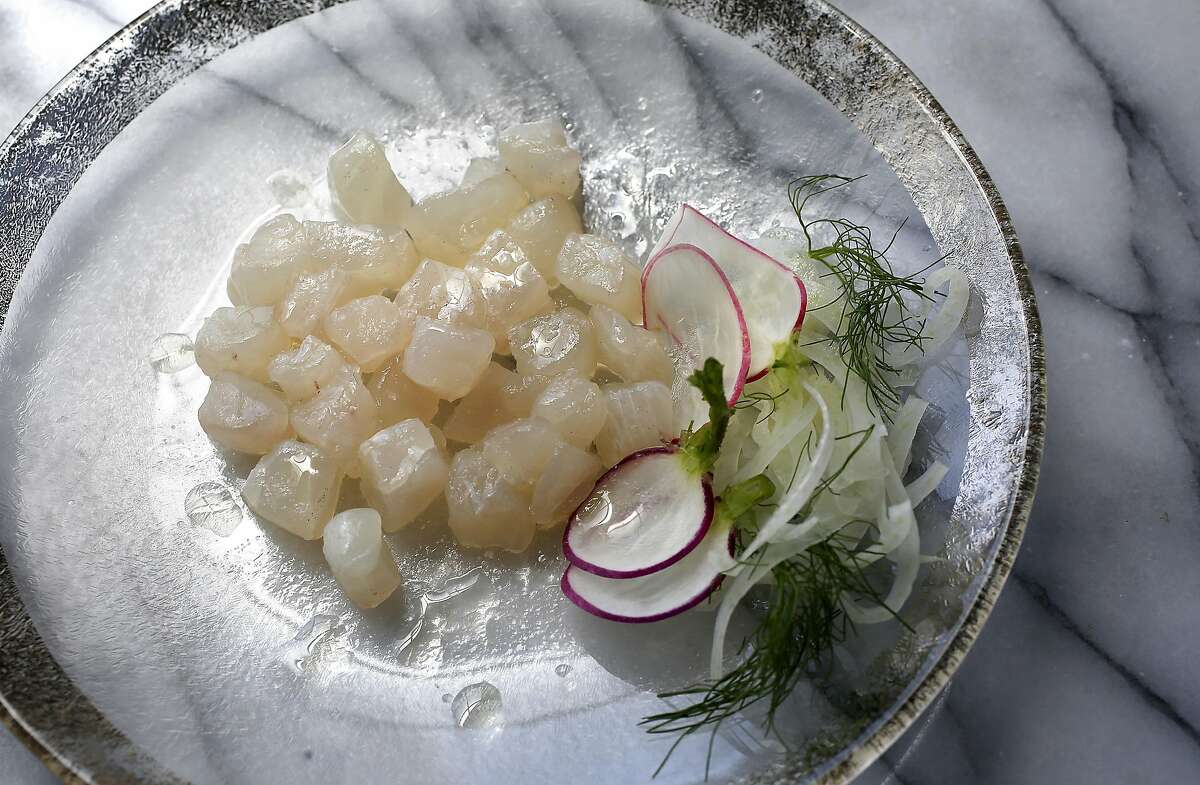 Raw halibut with lemon olive oil and radishes on Wednesday, June 1, 2016 in San Francisco, Calif.