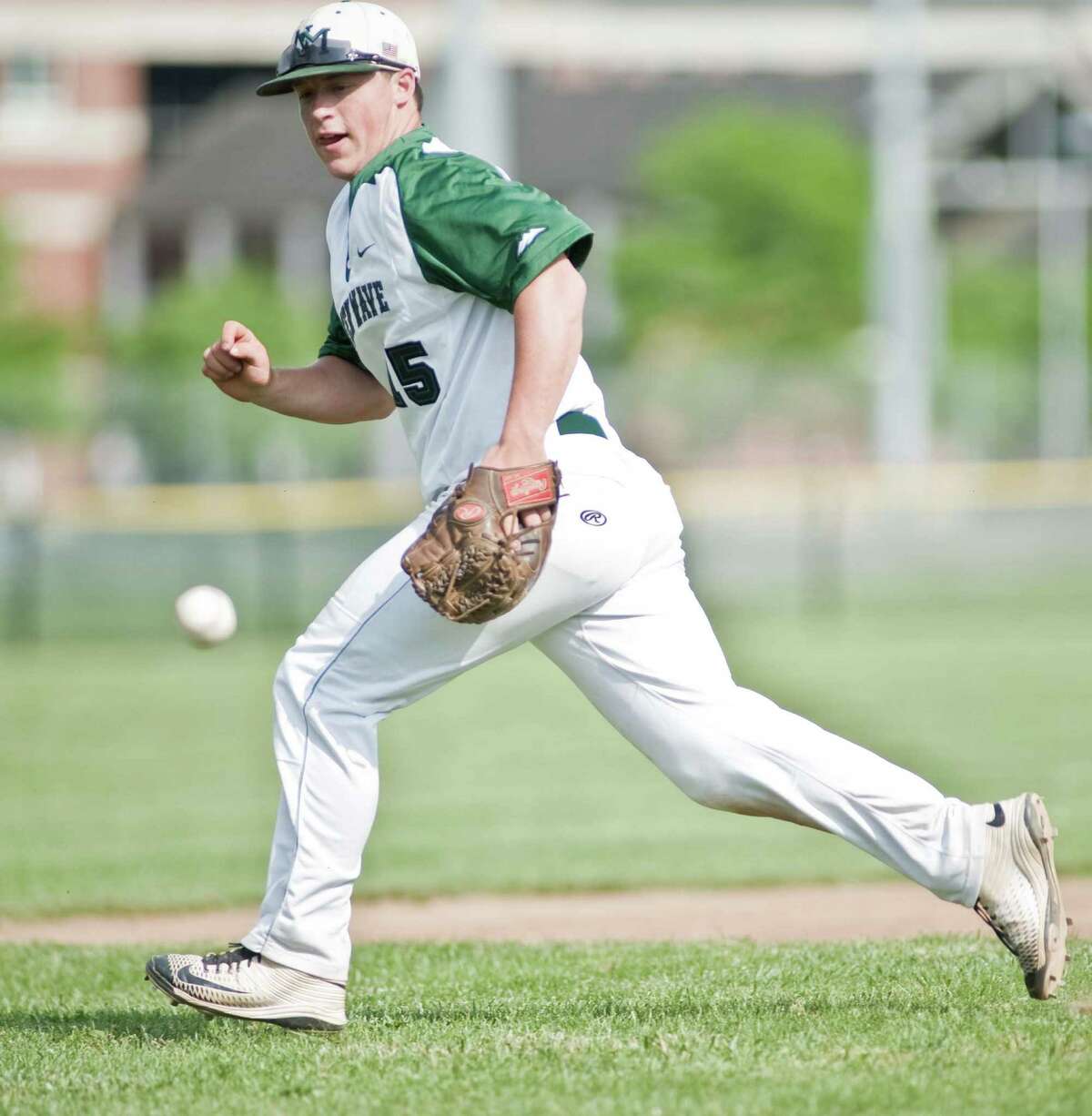 New Milford High School third baseman Brendon Profita chases a ground ball in a game against Bristol Central High School, played at New Milford. Wednesday, June 1, 2016
