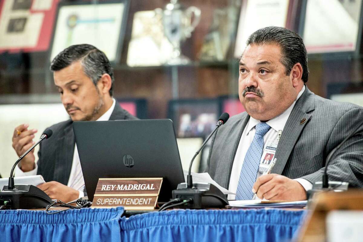 Superintendent Rey Madrigal, right, and president David Abundis, left, listen during a Harlandale ISD board of trustees meeting where they discussed the procedure for renaming schools, but no vote was taken on whether to rename Vestal Elementary after late Tejano star Emilio Navaira, in San Antonio, Texas on Wednesday, June 1, 2016.