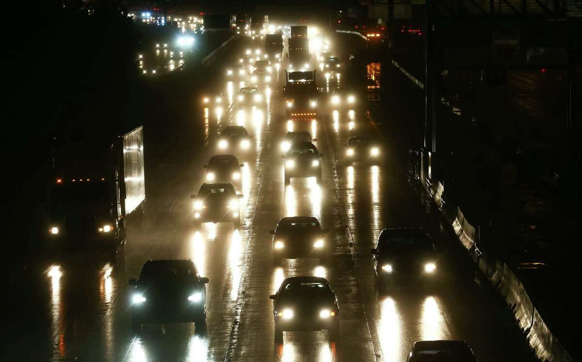 People drive on I-45 south of the Grand Parkway, after storms traveled through the area on June 1.