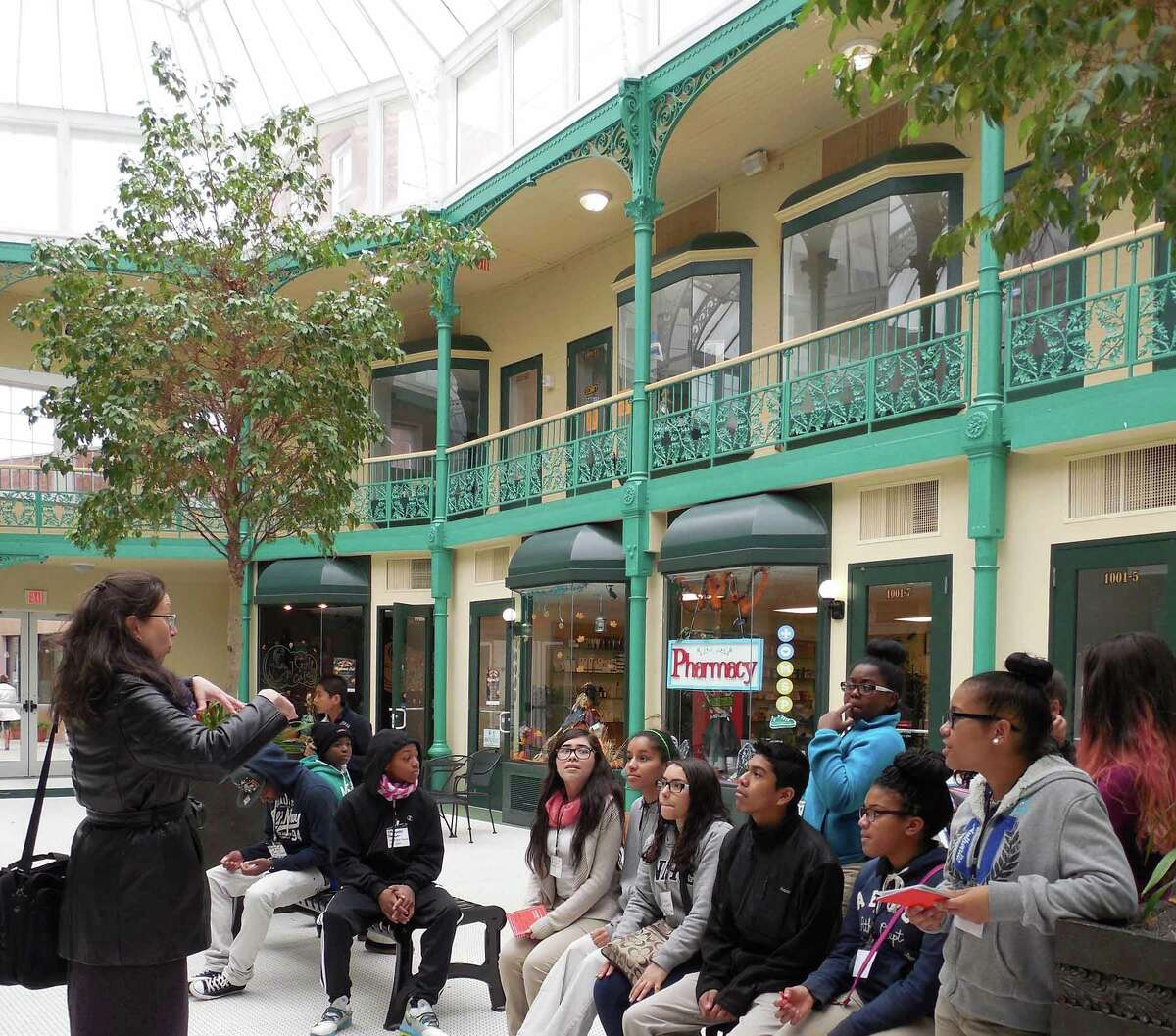 Janet Zamparo teaches peer docent students inside the Arcade Mall in Bridgeport. The Housatonic Museum of Art was awarded $15,000 from National Endowment for the Arts, funding a fourth year of the HMA Peer Docent Program.