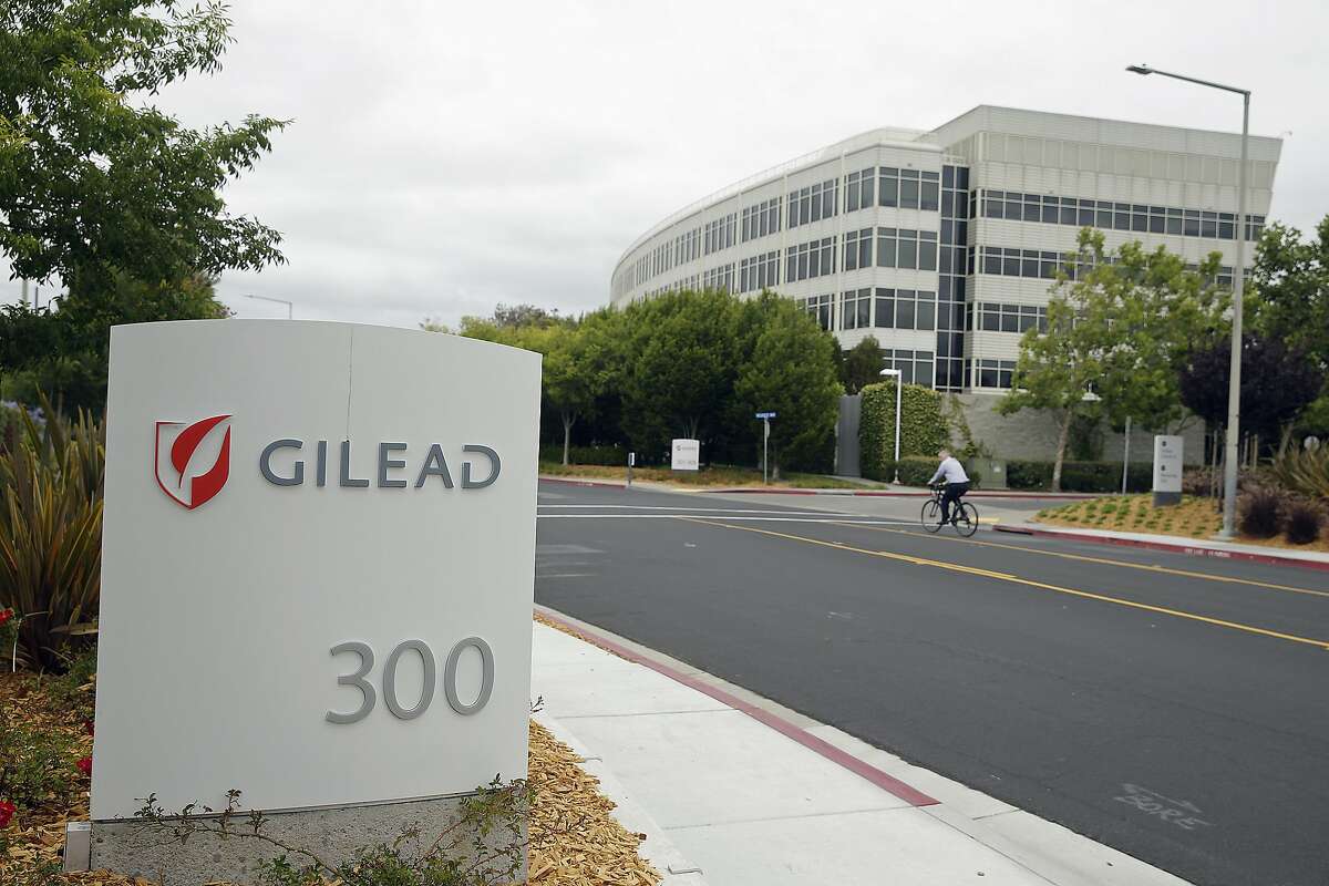 In this photo taken July 9, 2015, a man cycles near the headquarters of Gilead Sciences in Foster City, Calif. A bipartisan investigation by U.S. senators finds that the makers of a breakthrough drug for hepatitis C infection put profits before patients in pricing the $1,000-per-pill cure. The report released Tuesday by the Senate Finance Committee concludes that California-based Gilead Sciences was focused on maximizing revenue even as its own analysis showed a lower price would allow more patients to be treated for the liver-wasting disease. (AP Photo/Eric Risberg)