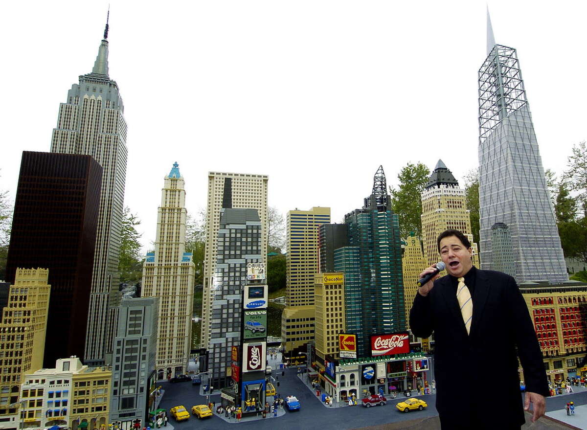 In this photo released by LEGOLAND California, opera singer Daniel Rodriguez sings "America the Beautiful," in front of LEGO models of the New York skyline during the re-opening of Miniland New York at LEGOLAND California in Carlsbad, Calif., Friday, March 11, 2005. Included in the new exhibit is a 28-foot tall LEGO model of the World Trade Center site's planned Freedom Tower, far right, which took LEGO model builders four months to build, according to LEGO. (AP Photo/LEGOLAND California, Denis Poroy)