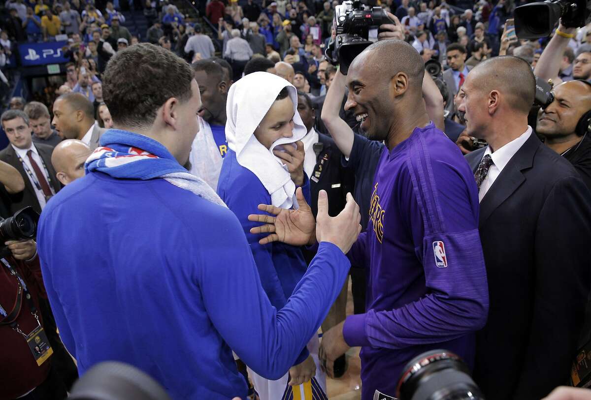Kobe Bryant (24) shakes hands with Klay Thompson (11) left, and Stephen Curry (30) center, after the Golden State Warriors played against the Los Angeles Lakers at Oracle Arena in Oakland, Calif., on Thursday, January 14, 2016.