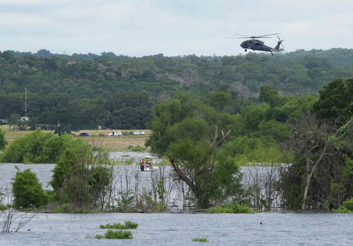 Search parties by helicopters and boats search Lake Belton Lake in between Kileen and Temple, Texas on Friday, June 3, 2016, for the remaining missing soldiers that were washed away in floods yesterday at Fort Hood.