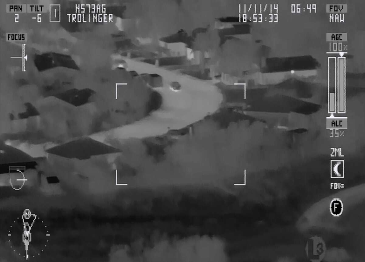 Video footage from a San Antonio Police helicopter shows an SAPD officer kicking a suspect who was on the ground with his hands raised. The incident was from Nov. 10, 2014, and the officer involved was suspended for two days.