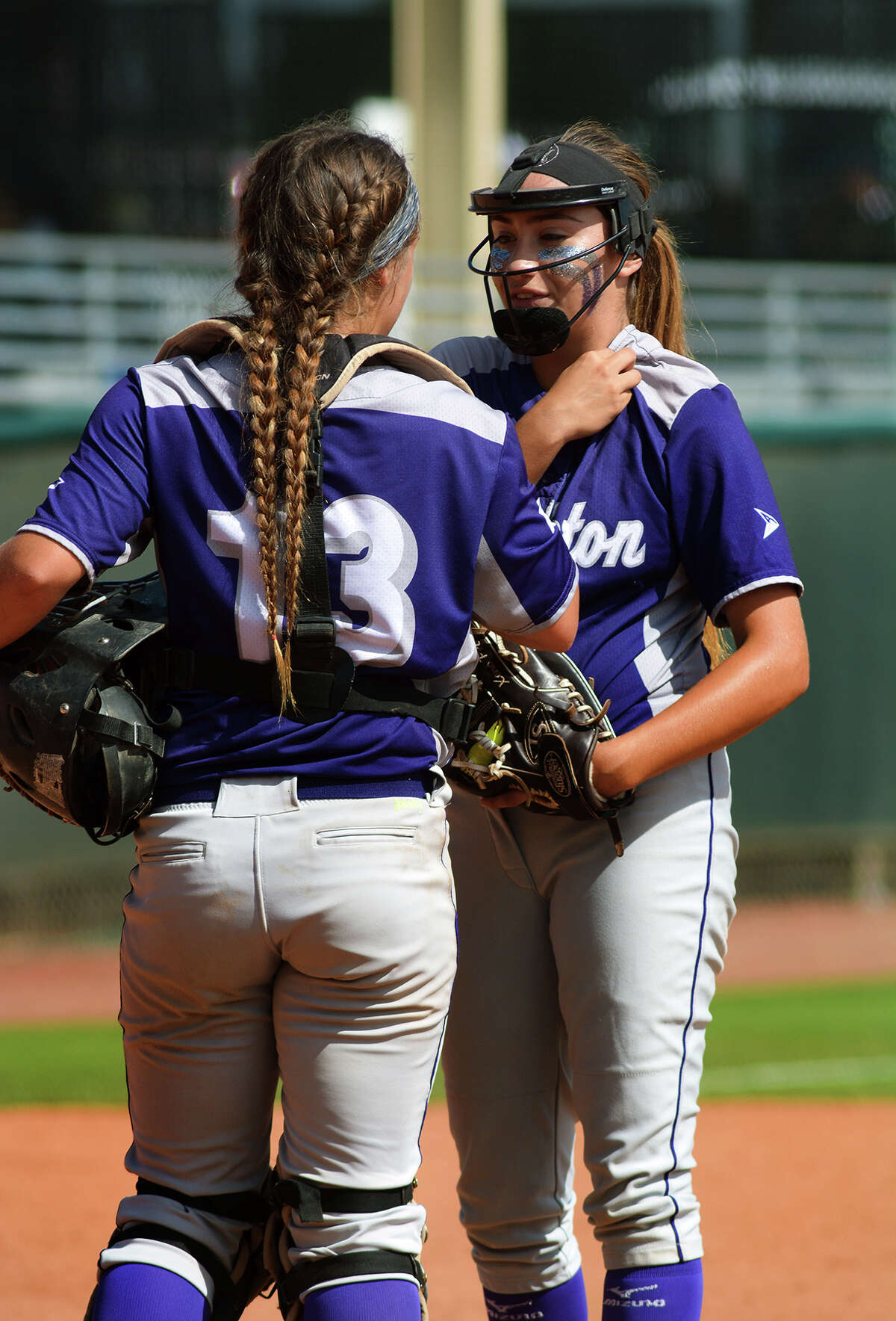 Angleton freshman pitcher Aaliyah Garcia, right, gets some re-assurance from Wildcat junior catcher Briana Cantu during the bottom of the 4th inning of their Class 5A semifinal matchup with Gregory-Portland at the 2016 UIL Softball State Championships at McCombs Field in Austin on Friday, June 3, 2016. (Photo by Jerry Baker/Freelance)