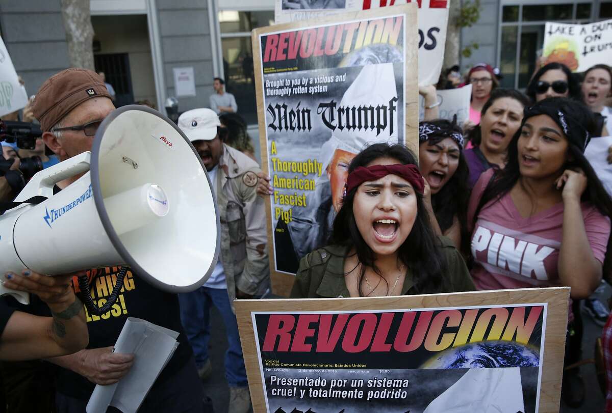 Anti-Trump protester Miriam Espinoza, 16, of San Jose, chants with others near the convention center before presidential candidate Donald Trump held a campaign rally June 2, 2016 in downtown San Jose, Calif.