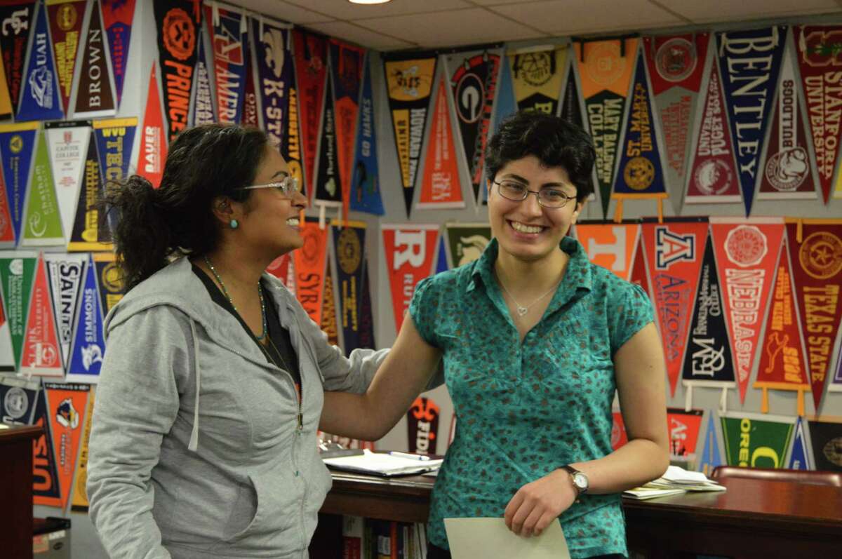 At HISD's Bellaire High School, senior Mojdeh Yadollahikhales, right, tells how she got ready to apply to college with help from counselor Rachael Faith.