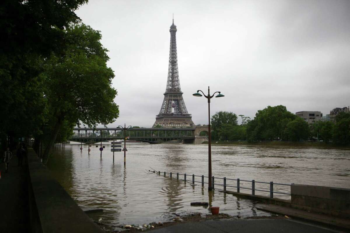 ﻿Cultural institutions across Paris have relocated masterpieces and turned away tourists as continuing rains pushed the Seine River on Friday to its highest levels since 1982. The river was expected to crest Friday evening at 20.7 to 21.3 feet.