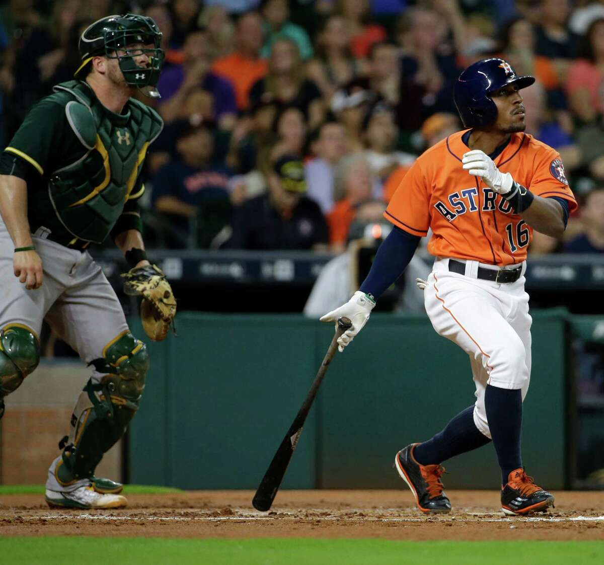 Houston Astros Tony Kemp watches his triple hit against the Oakland Athletics during the first inning of MLB game at Minute Maid Park Friday, June 3, 2016, in Houston.