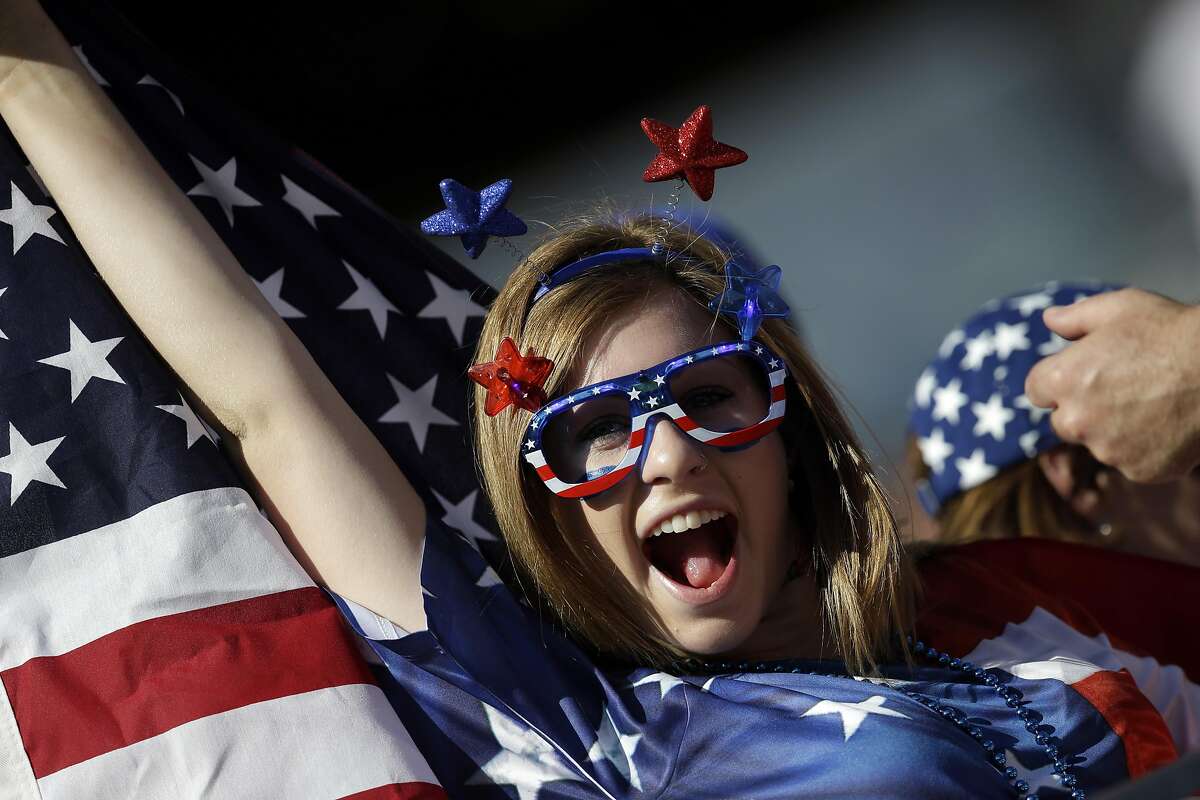 A fan of the US team holds a flag before a Copa America Centenario Group A soccer match between the US and Colombia at Levi's Stadium in Santa Clara, Caif., Friday, June 3, 2016.(AP Photo/Marcio Jose Sanchez)