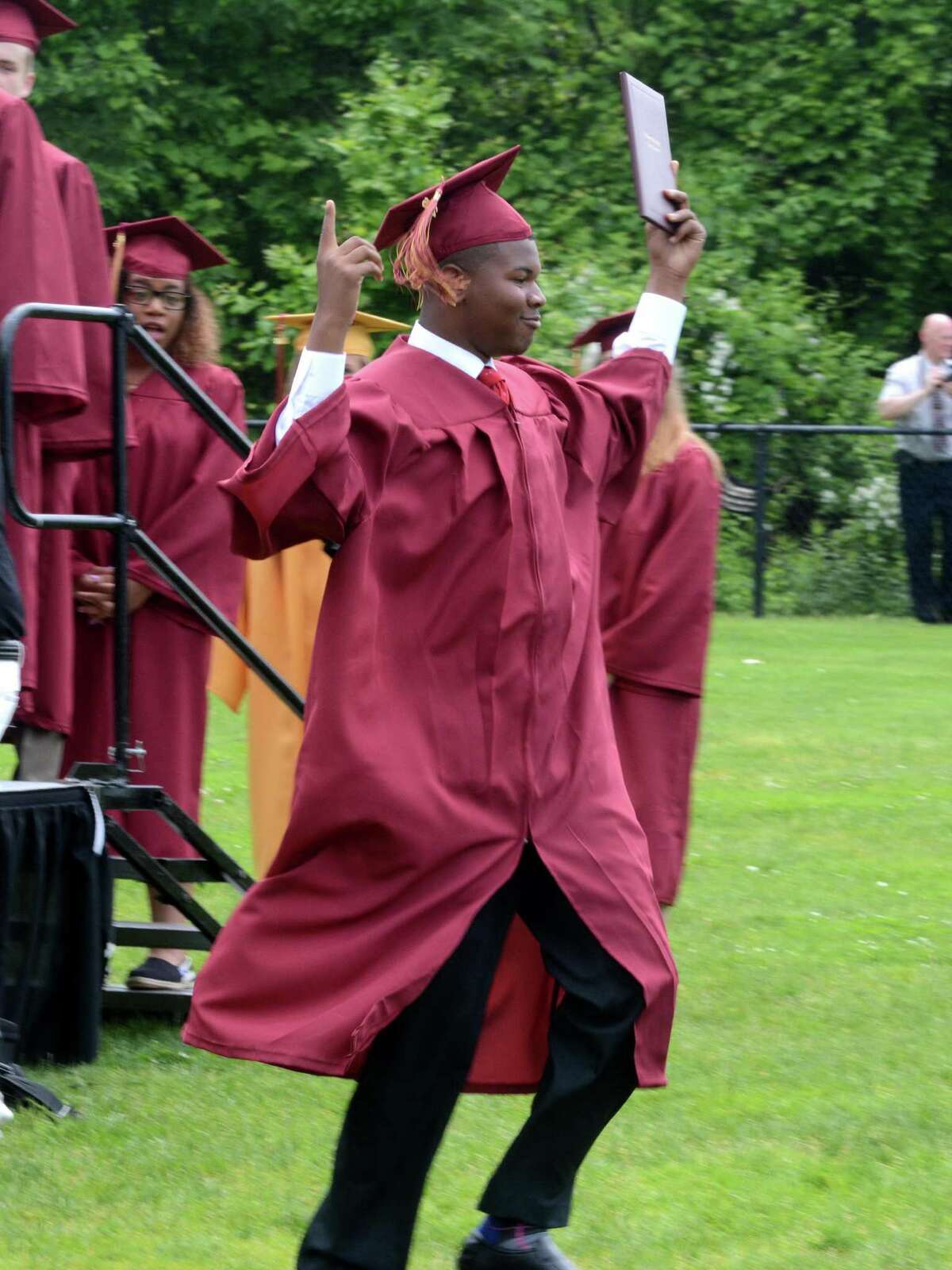 Myles Antoney Gee breaks out in dance on his way back to his seat after receiving his diploma. St. Josephs High School in Trumbull, Conn. Graduation ceremony took place at their campus on Sat. June 4, 2016.