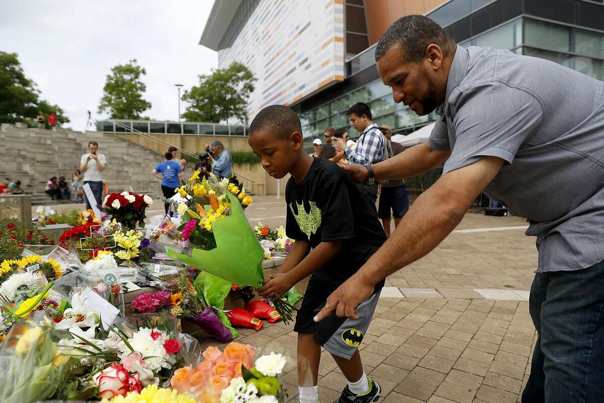 LOUISVILLE, KY - JUNE 4: Mourners leave flowers at a memorial following the death of boxing legend Muhammad Ali outside the Muhammad Ali Center June 4, 2016 in Louisville, Kentucky. Ali died at a Phoenix-area hospital, where he had spent the past few days being treated for respiratory complications. (Photo by Aaron P. Bernstein/Getty Images)