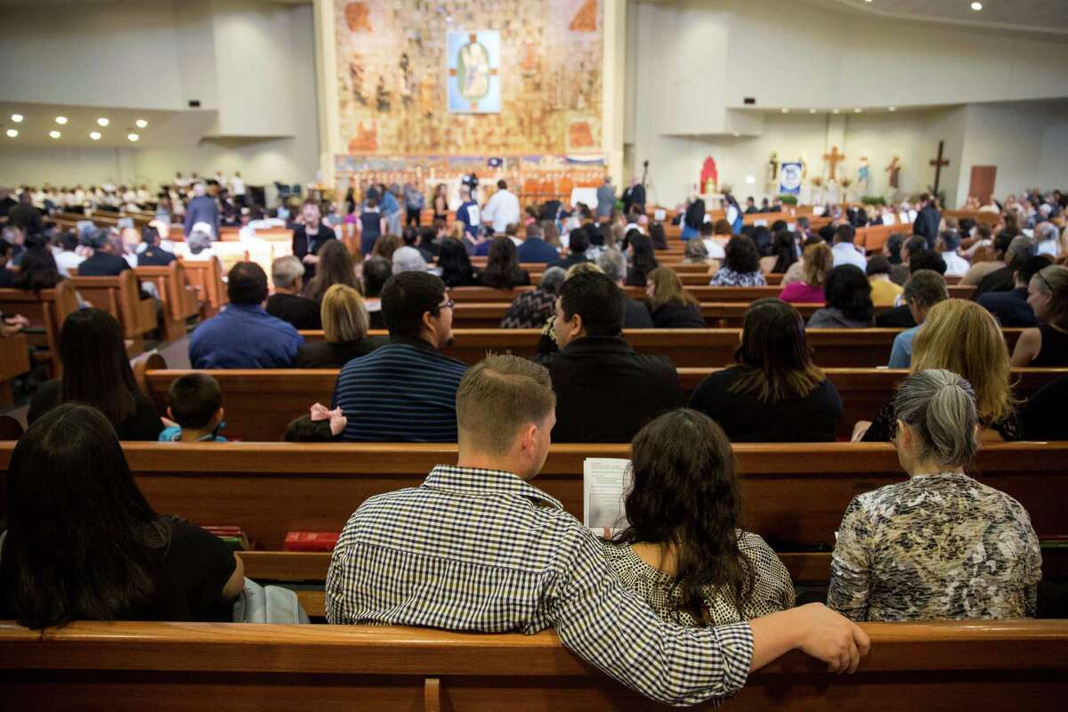 Hundreds pack church to say farewell to Father Eddie Bernal