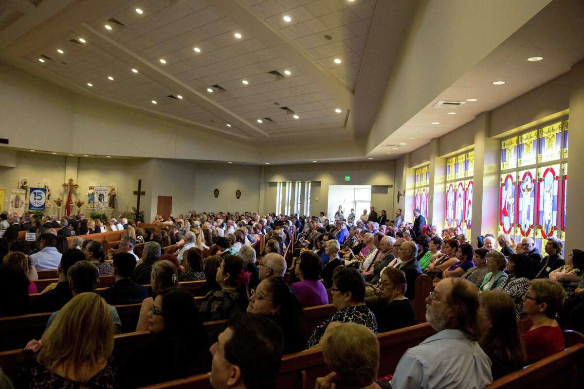 Hundreds pack church to say farewell to Father Eddie Bernal