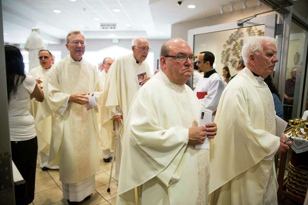 Hundreds pack church to say farewell to Father Eddie Bernal