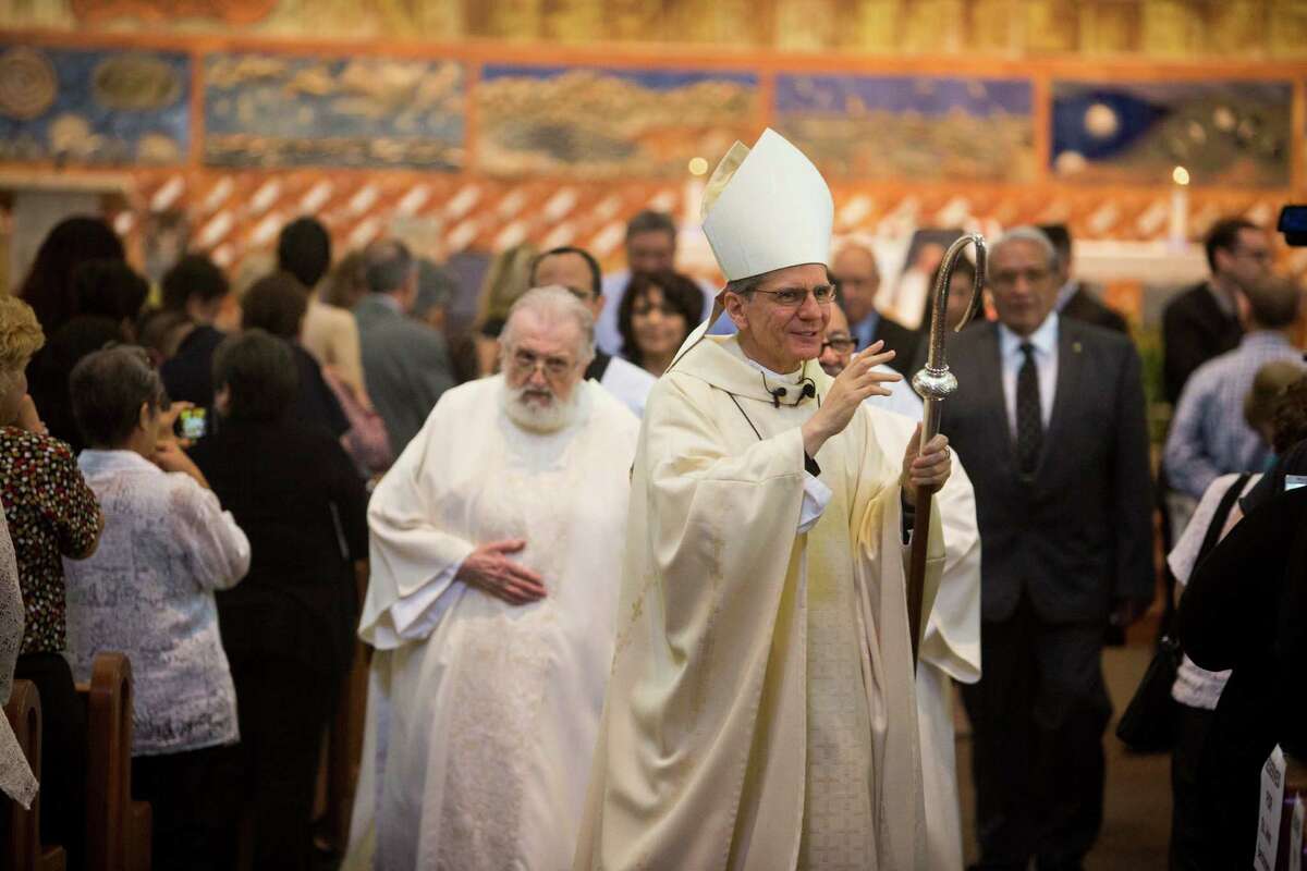 Hundreds pack church to say farewell to Father Eddie Bernal