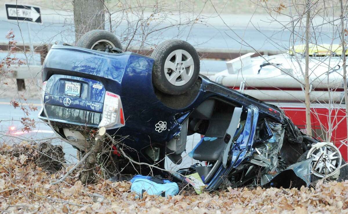 The scene of a rollover of one vehicle in the southbound lane near exit 27 of the Merritt Parkway in Greenwich, Conn., Friday afternoon, Jan. 2, 2015.