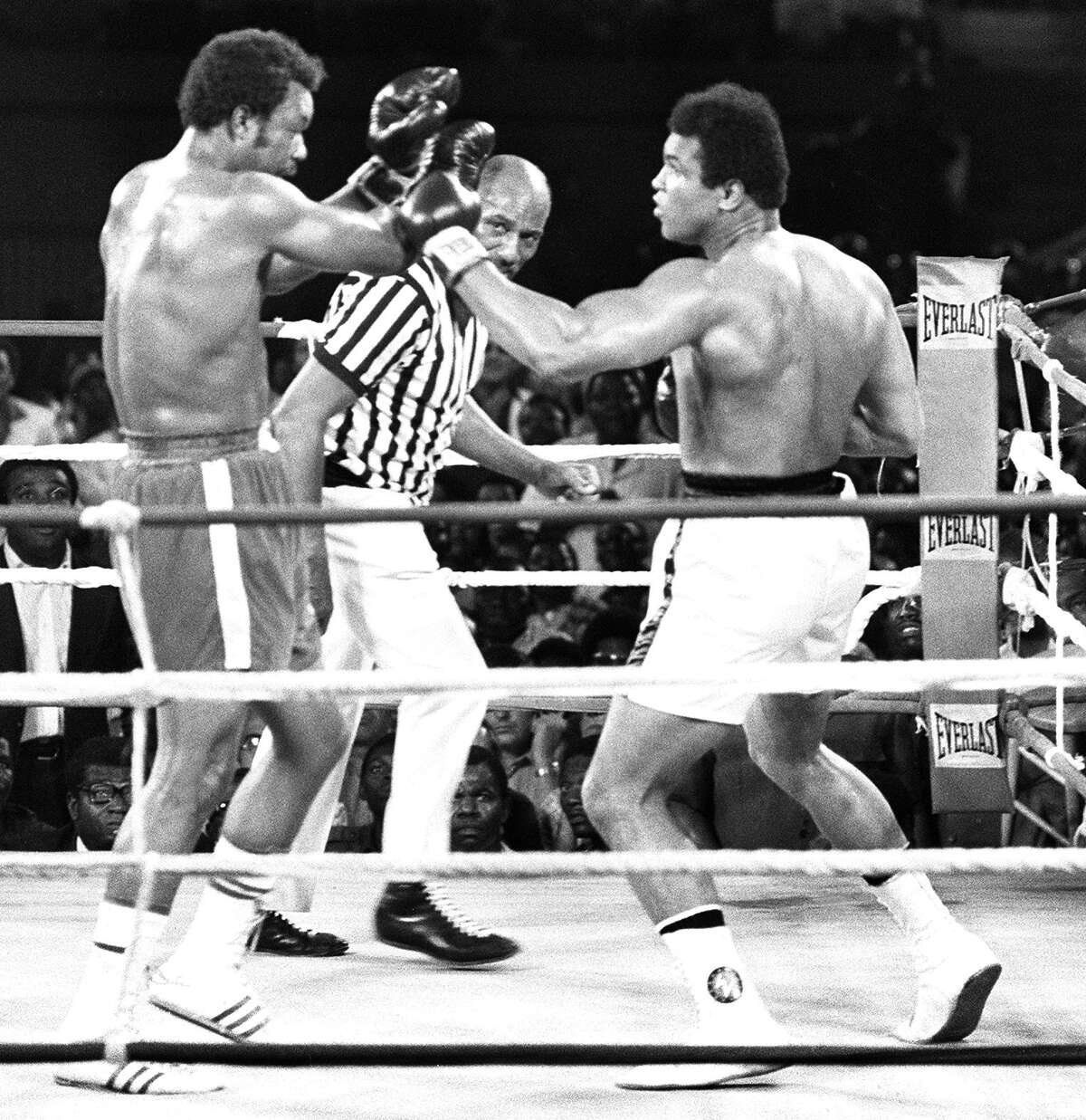 (FILES) This file photo taken on October 30, 1974 shows the fight opposing former world heavyweight boxing champion the American Muhammad Ali (R) and his compatriot and titleholder George Foreman (L) in Kinshasa. Ali won and got back his title. Boxing icon Muhammad Ali died on Friday, June 3, a family spokesman said in a statement. "After a 32-year battle with Parkinsons disease, Muhammad Ali has passed away at the age of 74," spokesman Bob Gunnell said. / AFP PHOTO / --/AFP/Getty Images