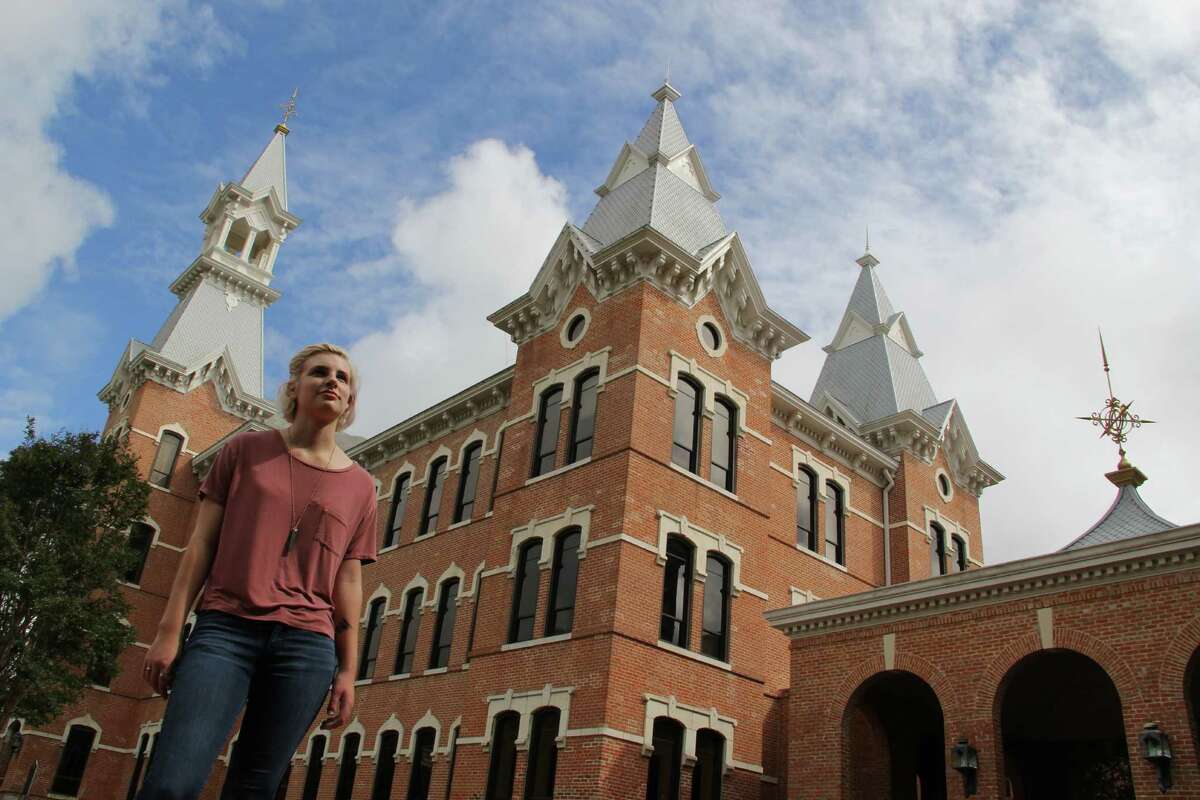 ﻿Anya Maltsberger ﻿stands outside of Burleson Hall, originally a dorm for female students﻿.