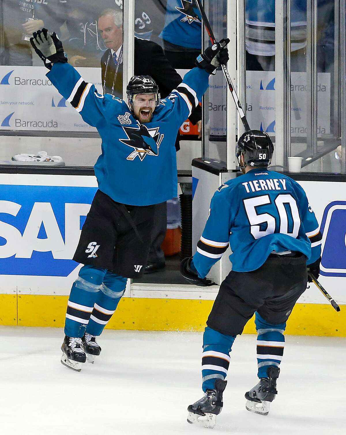 San Jose Sharks' Joonas Donskoi celebrates his game-winning goal with Chris Tierney in overtime of 3-2 win over Pittsburgh Penguins in Game 3 of NHL Stanley Cup Final at SAP Center in San Jose, Calif., on Saturday, June 4, 2016.