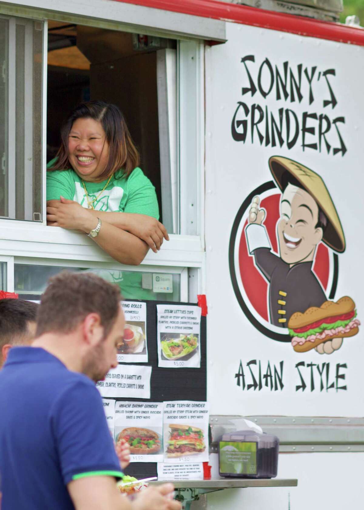 Jithravan Julsuconth, from Norwalk, gives service with a smile from her food truck "Sonny's Grinders". The 20th annual Teddy Bear Festival hosted by the Woman?’s Club of Greater New Milford took place on the town green on Saturday, June 4th from 10 to 3.
