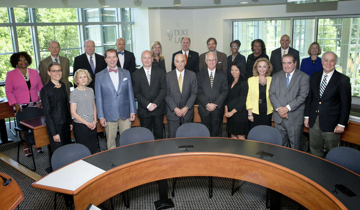 Supreme Court justice Antonin Scalia teaches a Master of Judicial Sciences class at Duke School of Law and afterwards poses for group and individual photos