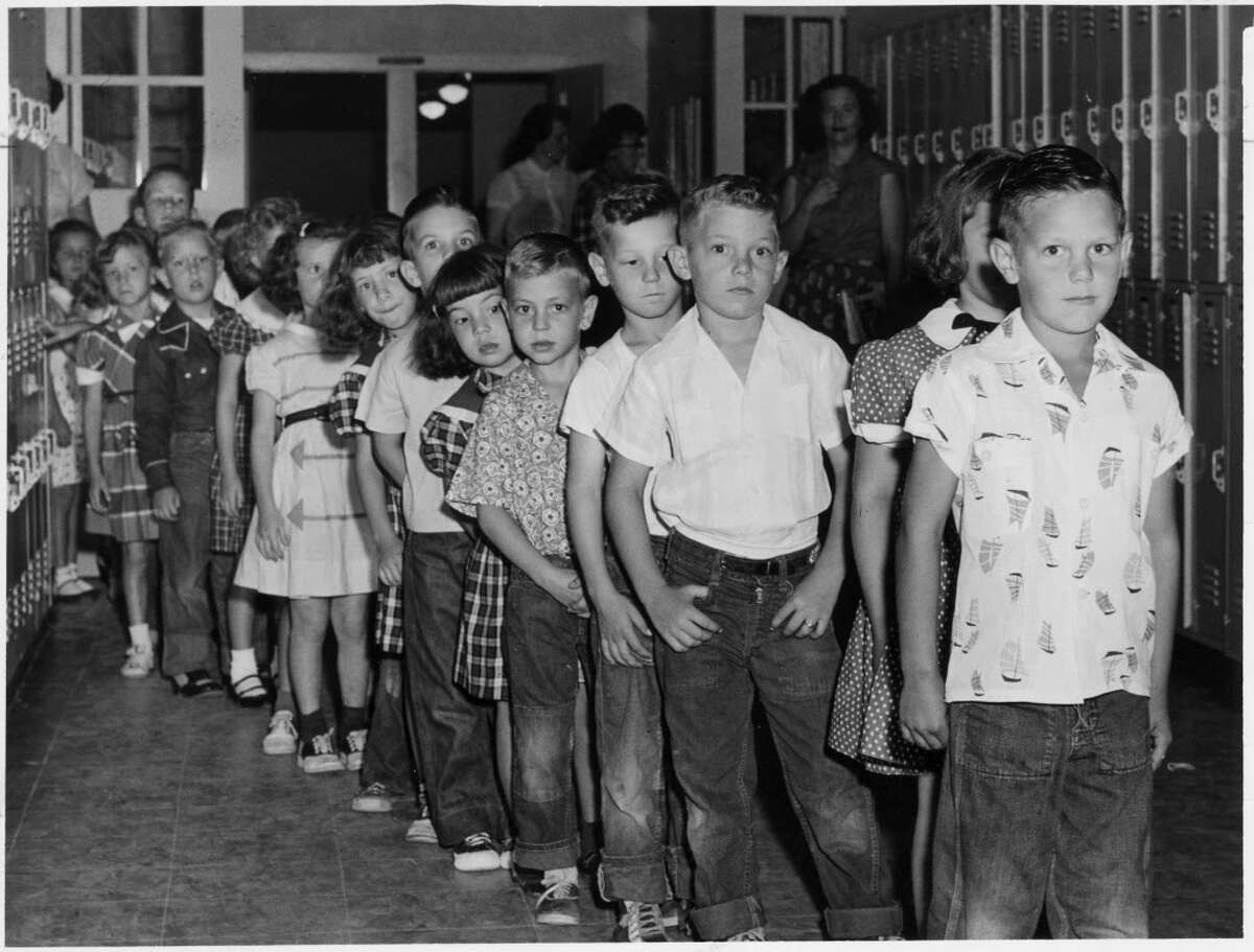 ﻿Schoolchildren await Salk vaccine shots at Houston's Hohl Elementary in 1955. ﻿Harris County's polio crisis was unmatched in Texas.