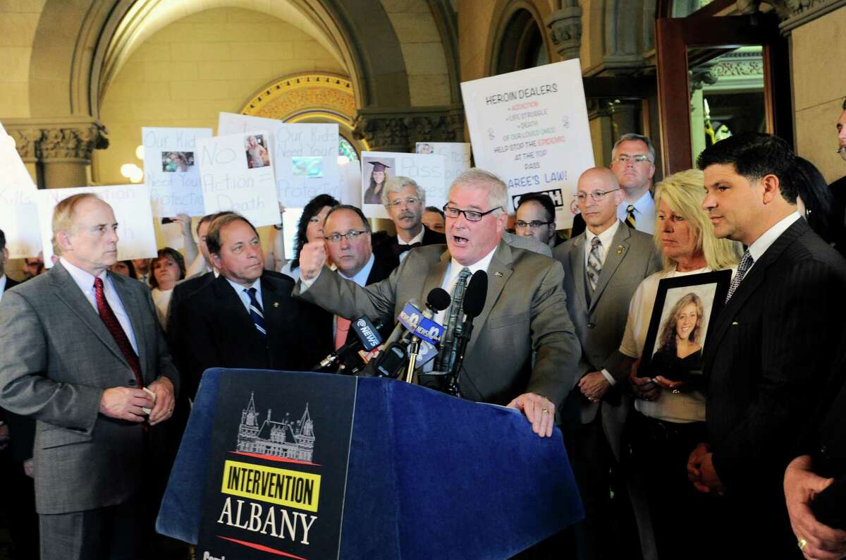 In this June 1, 2016 photo, Assembly Minority Leader Brian Kolb, R-Canandaigua, center, speaks during a news conference for Legislative Intervention for highly addictive controlled drugs that have led to heroin overdoses at the state Capitolin Albany, N.Y. As the 2016 legislative session draws to a close lawmakers could vote on measures to combat heroin addiction. (AP Photo/Hans Pennink) ORG XMIT: NYHP126