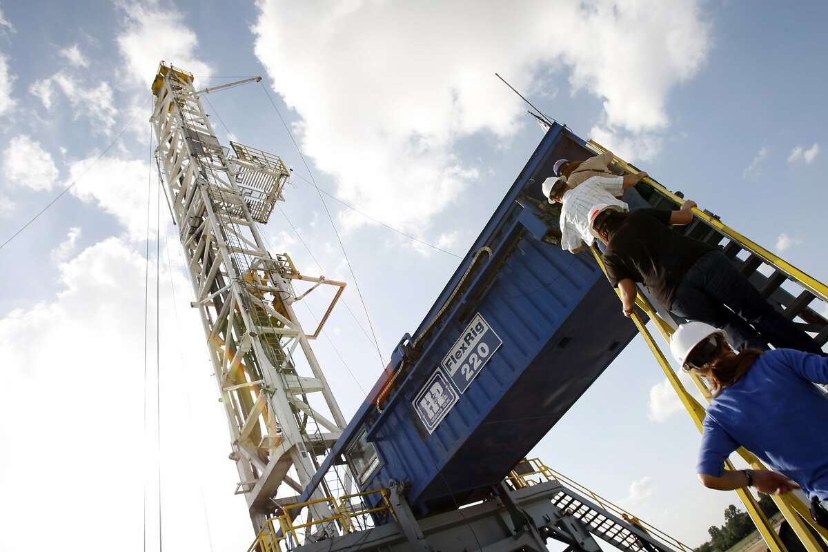 A Devon Energy flex-drilling rig reaches the blue sky Tuesday, June 10, 2008, near Denton.
