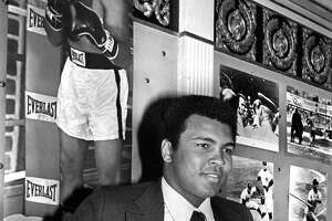 Muhammad Ali shows off the Hickok Belt, a professional athlete of the year trophy awarded annually, in 1975. Ali gave hope to the hopeless, replacing despair with dreams.