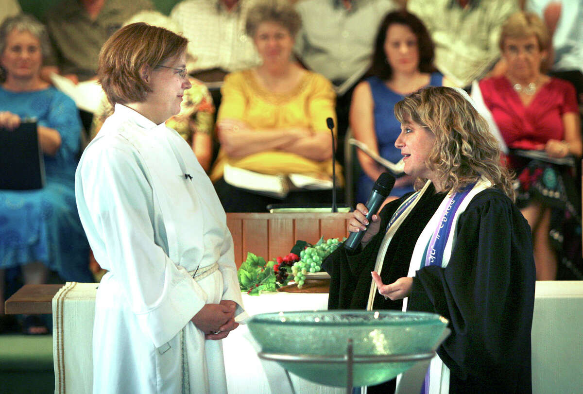 The Rev. Kelly S. Allen (left) listens to Rabbi Allison Bergman Vann of Temple Beth-El during Allen’s installation as University Presbyterian Church pastor in 2009.