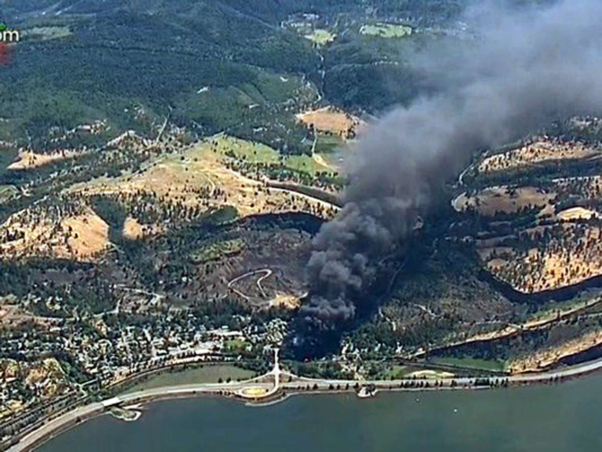 In this frame from video provided by KGW-TV, smoke billows from a Union Pacific train that derailed Friday, June 3, 2016 in Oregon's scenic Columbia River Gorge. The accident sparked a fire and an oil spill near the Columbia River. No injuries were reported. (KGW-TV via AP)