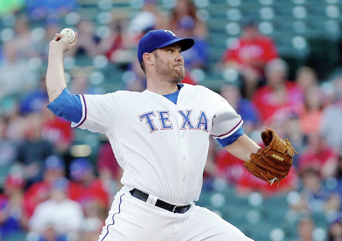 Texas Rangers starting pitcher Colby Lewis (48) throws during the first inning of a baseball game against the Houston Astros Monday, June 6, 2016, in Arlington, Texas. (AP Photo/Brandon Wade)