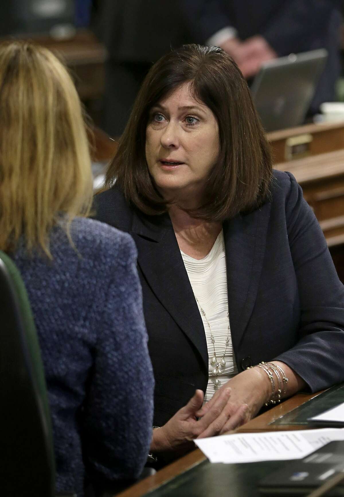 In this photo taken March 12, 2015, Assemblywoman Susan Bonilla, D-Concord, right, talks with seat mate Assemblywoman Jacqui Irwin,D-Camarillo, at the Capitol in Sacramento, Calif. Bonilla and Democratic challenger, Orinda Mayor Steve Glazer are facing off in a special election to fill the 7th Senate District seat, Tuesday, May 19, 2015. (AP Photo/Rich Pedroncelli, file)