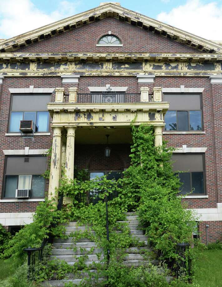 An overgrown entrance of the former Ann Lee Nursing Home Tuesday June 7, 2016 in Colonie, NY.  (John Carl D'Annibale / Times Union) Photo: John Carl D'Annibale / 40036866A
