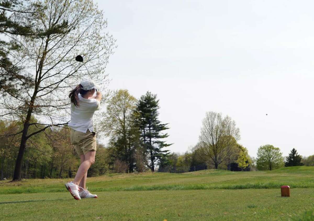 Lili Rosenkranz of Greenwich Academy watches her ball disappear into the distance as she hits off the 2nd tee during match play against The Hotchkiss School and The Taft School at Round Hill Club, Greenwich, Wednesday, April 21, 2010.