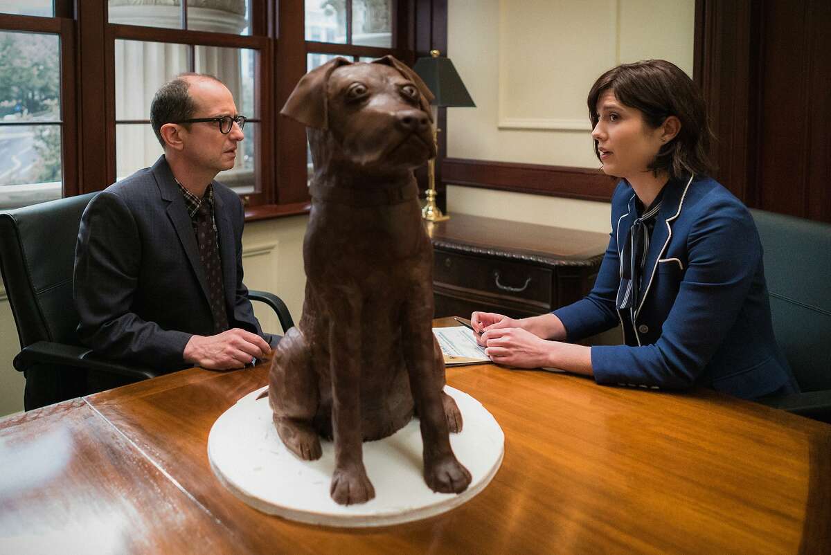 Laurel Healy (Mary Elizabeth Winstead) and  John Quilty as Chocolate Dog Man in "BrainDead"