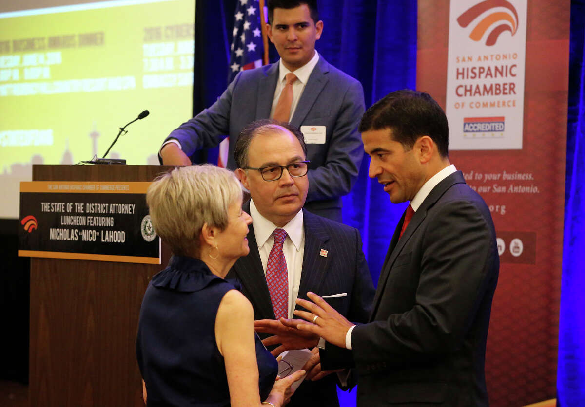 Bexar County District Attorney Nicholas "Nico" LaHood (right) speaks Wednesday June 8, 2016 with Phyllis Siegel (left) and San Antonio Hispanic Chamber of Commerce President and CEO Ramiro A. Cavazos (center bottom) before LaHood presented his inaugural State of the District Attorney address at the Embassy Suites Riverwalk Hotel. LaHood gave an insider's perspective of the challenges and issues he and his staff have faced on a day-to-day basis.