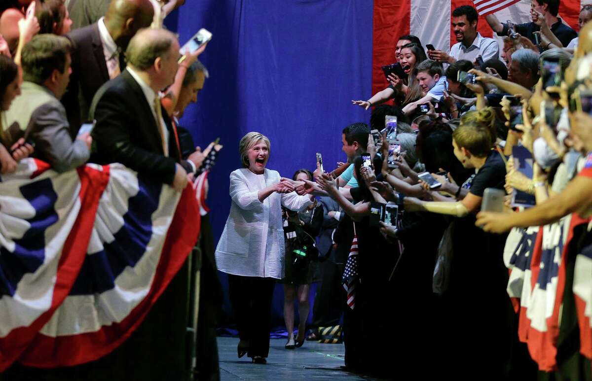 Democratic presidential candidate Hillary Clinton greets supporters as she arrives to speak during a presidential primary election night rally, Tuesday, June 7, 2016, in New York. (AP Photo/Julie Jacobson)
