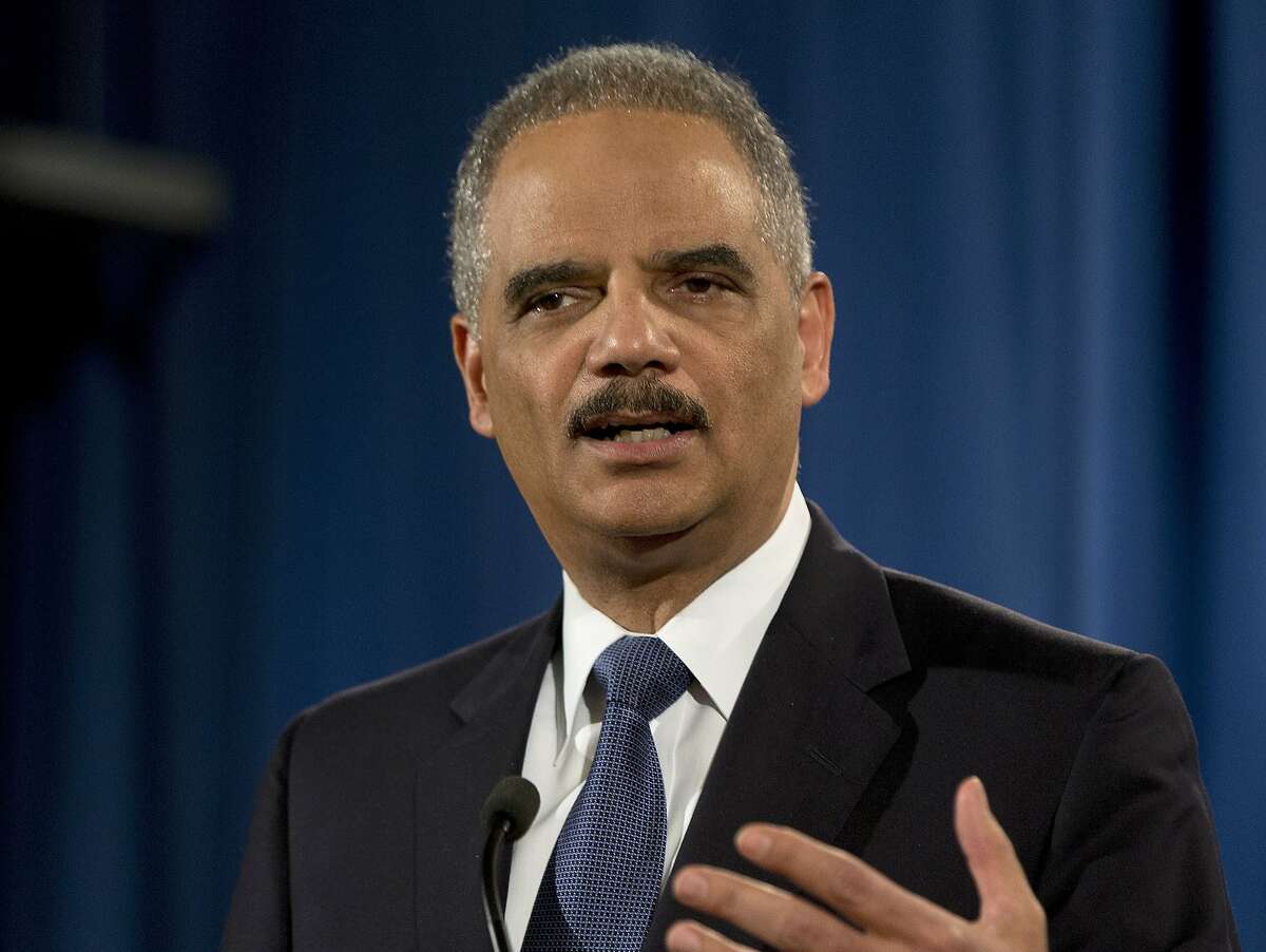 FILE - In this March 4, 2015, file photo, then-Attorney General Eric Holder speaks at the Justice Department in Washington. Holder says Edward Snowden performed a "public service" in stoking a national debate about secret domestic surveillance programs, but that he should still return to the U.S. to stand trial. Holder spoke with CNN political commentator David Axelrod in a podcast released May 30, 2016. (AP Photo/Carolyn Kaster)