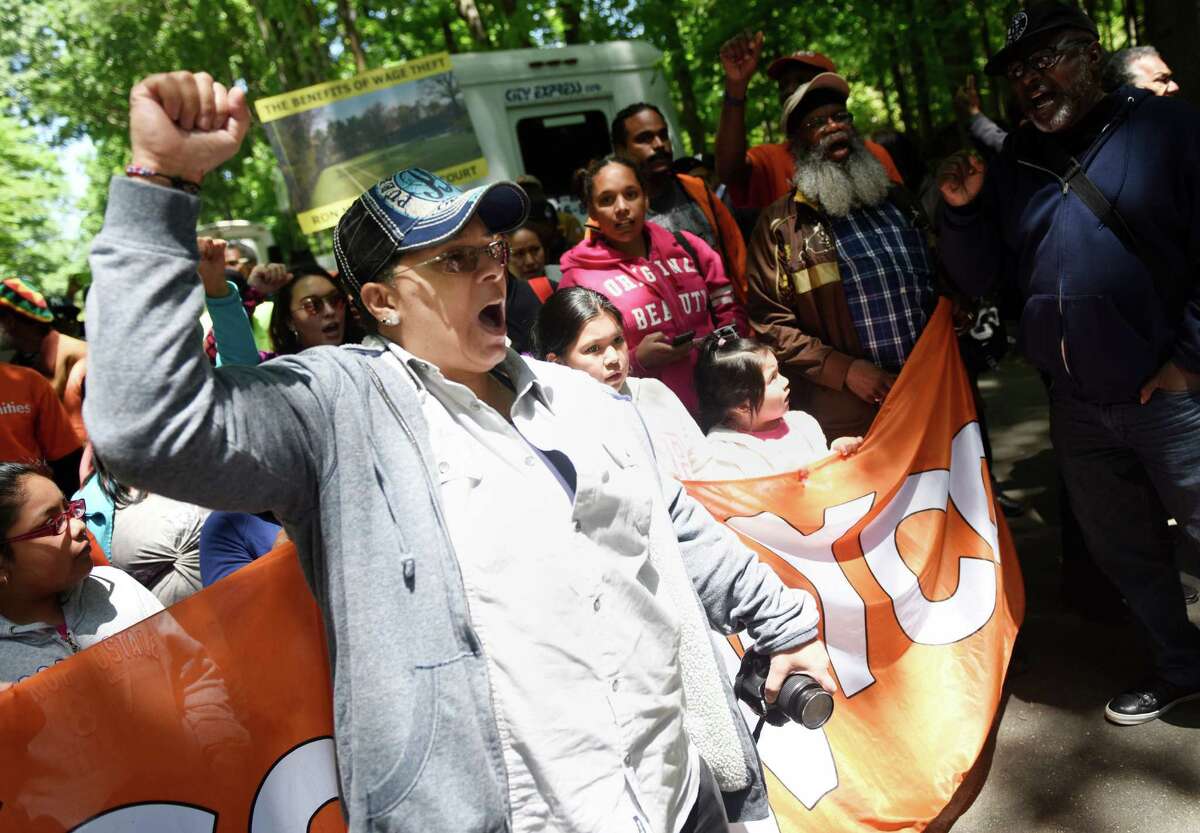 Marie Maisonet, of East New York, Brooklyn, leads a chant with a group of housing activists.